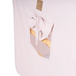 Large White Ladder House With a Pink Cover