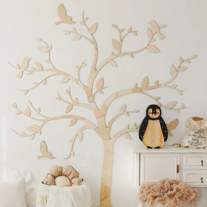 Natural wood wall tree with birds, nursery decor, wooden penguin on white cabinet