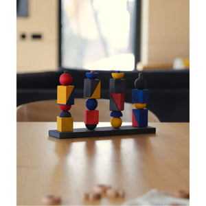 Colorful wooden stacking balance toy displayed on a table, designed for Montessori-inspired coordination, creativity and screen-free play.