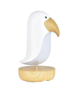 Lámpara de mesa moderna en forma de pájaro con cuerpo blanco y pico y base con efecto madera