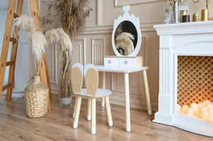 White FAMILY Princess Beauty Table with crown mirror and matching chair styled in an elegant children’s room