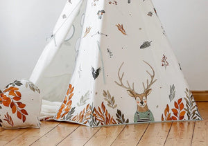 Close-up of the Forest Friends teepee with a friendly deer illustration among autumn leaves