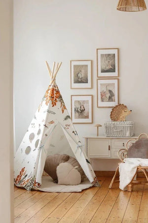 Moi Mili woodland teepee styled in a children’s room with animal wall art, soft cushions and wooden furniture