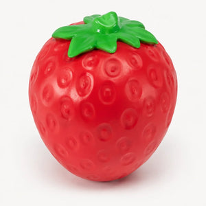 Red strawberry shaped toy with green leaves and textured surface