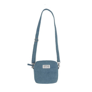 Borsa fotografica in tessuto blu con tracolla regolabile e logo Hoppstar frontale