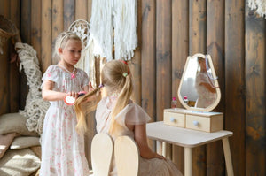 Children playing hairdresser at white FAMILY Tulip Beauty Table with matching chair and mirror