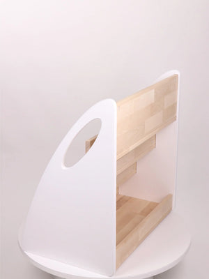 Rear product view of white and natural wood Montessori bookshelf showing additional storage compartment
