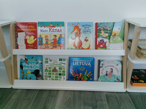 Front view of modular Montessori bookshelf with eight children’s book covers displayed across two levels
