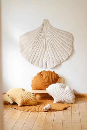 Cream Moi Mili Ginkgo Leaf Mat wall décor styled with coordinating shell cushions and natural wood furniture
