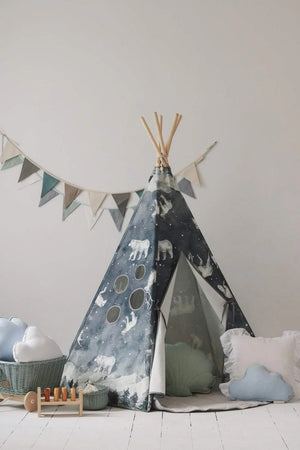 Moi Mili Night Sky teepee styled with cloud cushions, woven baskets and a wooden toy in a bright children’s room