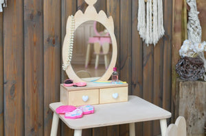 Close-up of natural Baltic birch Crown Beauty Table mirror, drawers and pretend accessories