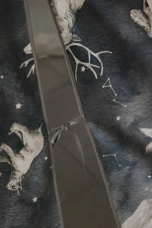Close-up of the Night Sky teepee entrance tie, animal illustration and constellation details