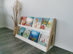 One Little Pine two-shelf Montessori bookshelf displaying children’s books front-facing in a calm reading corner