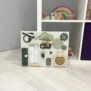 Wooden sensory activity board with zippers, gears, and knobs for toddler fine motor skills development