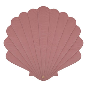 Front product view of the powder pink Moi Mili shell playmat on a white background