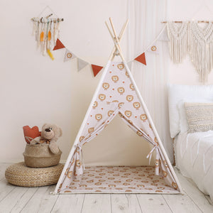Lions children’s teepee tent with matching padded floor mat in a softly styled bedroom