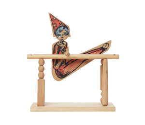Wooden Story Acrobat Girl wooden toy performing a somersault on its wooden bar