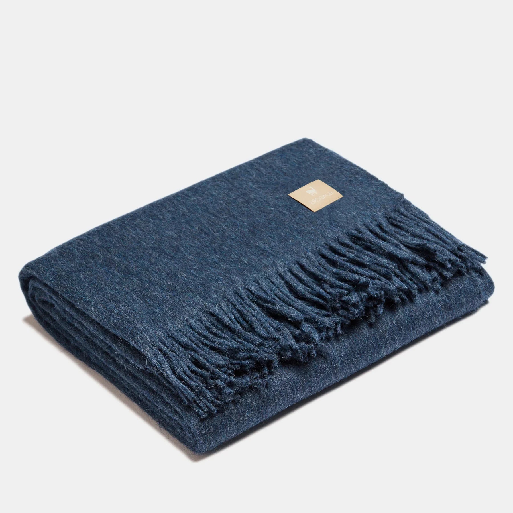 Couverture jetée en laine ALPAKA bleu marine premium, texture douce et franges classiques