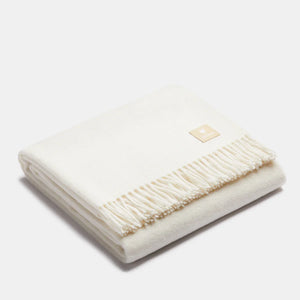 Couverture jetée en laine ALPAKA ivoire à motif chevrons premium, texture douce et franges classiques