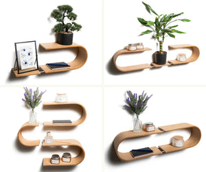 Estante de pared moderno de madera con diseño curvo, ideal para exhibir plantas, libros y objetos decorativos.