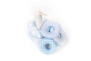 Soft baby stacking toy with blue and white fabric rings in polka dot and gingham patterns