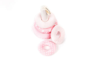 Soft fabric stacking ring toy in pastel pink with polka dots, stars, and stripes patterns