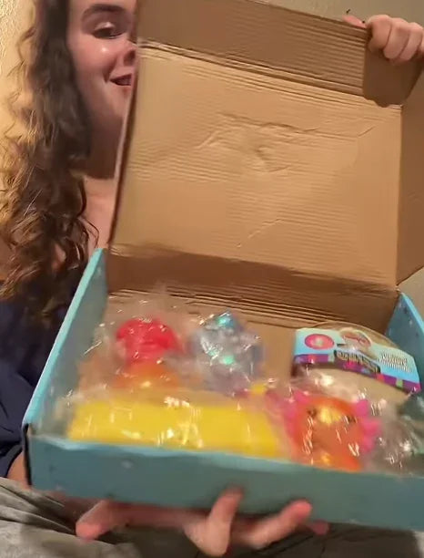 A woman holds opened squishy surprise box.