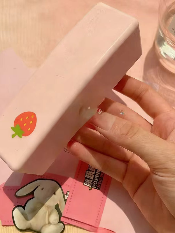 Woman holds strawberry butter squishy from Surprise box..