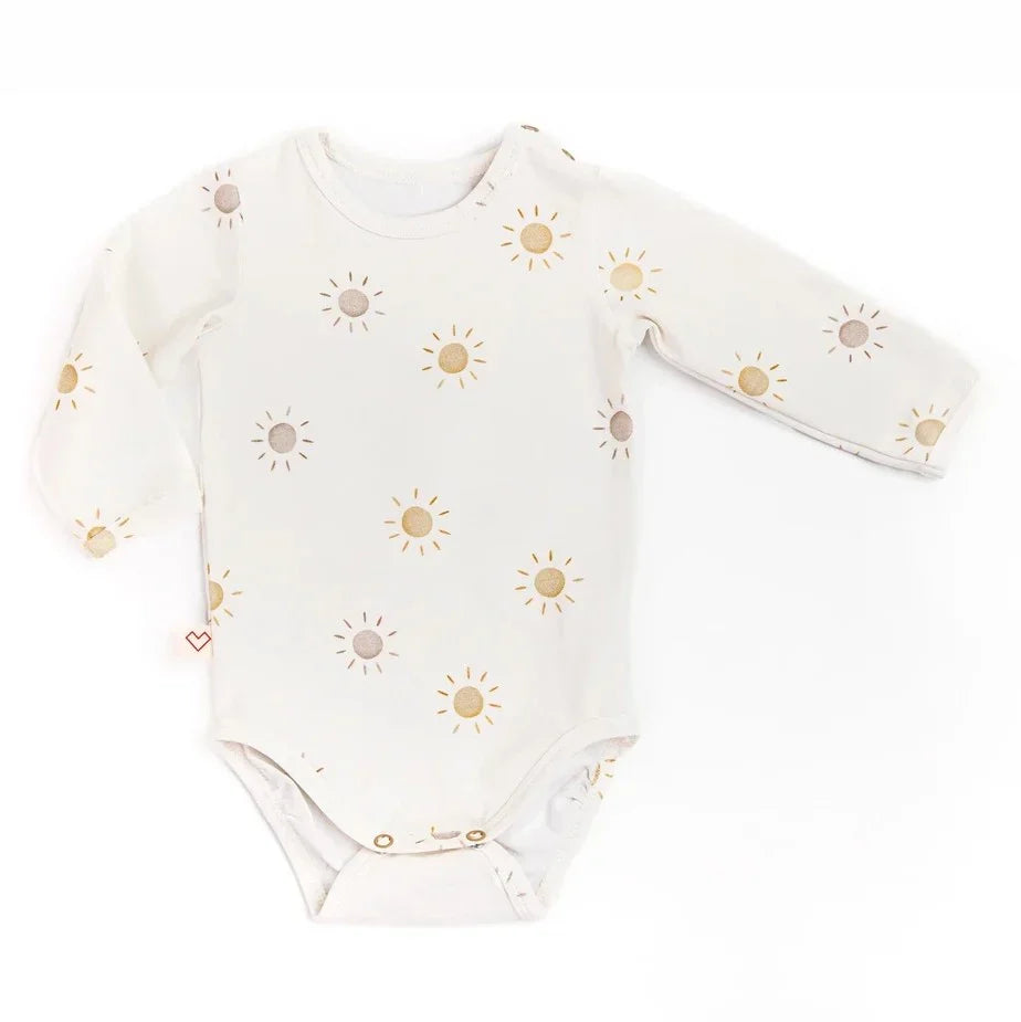 White baby bodysuit with long sleeves and yellow sun print pattern, snap closures