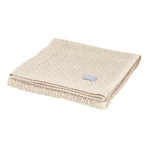 Couverture bébé en tricot texturé beige avec motif tissé doux et bords repliés