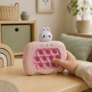Child pressing a bubble on pink electronic bunny Pop It game console during play