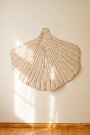 Cream Ginkgo Leaf Mat displayed as oversized textile wall décor in a warm neutral children’s room