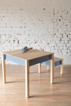 Dusty Blue children’s storage table and chair styled in a simple learning space