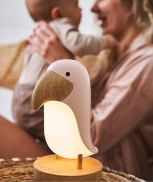 Veilleuse pour chambre d'enfant en forme d'oiseau avec bec et socle en bois, lueur douce et chaude