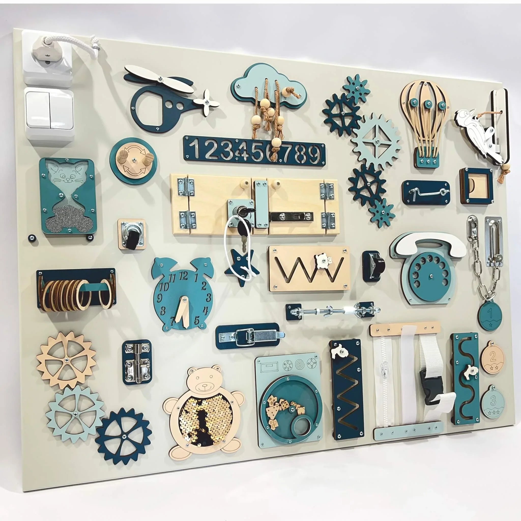 Wooden sensory activity board with gears, locks, zippers, and numbers in teal and natural wood tones
