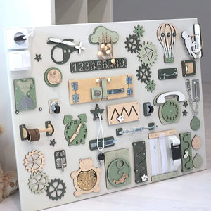 Wooden sensory activity board with gears, zippers, clock, and animal shapes for toddler development
