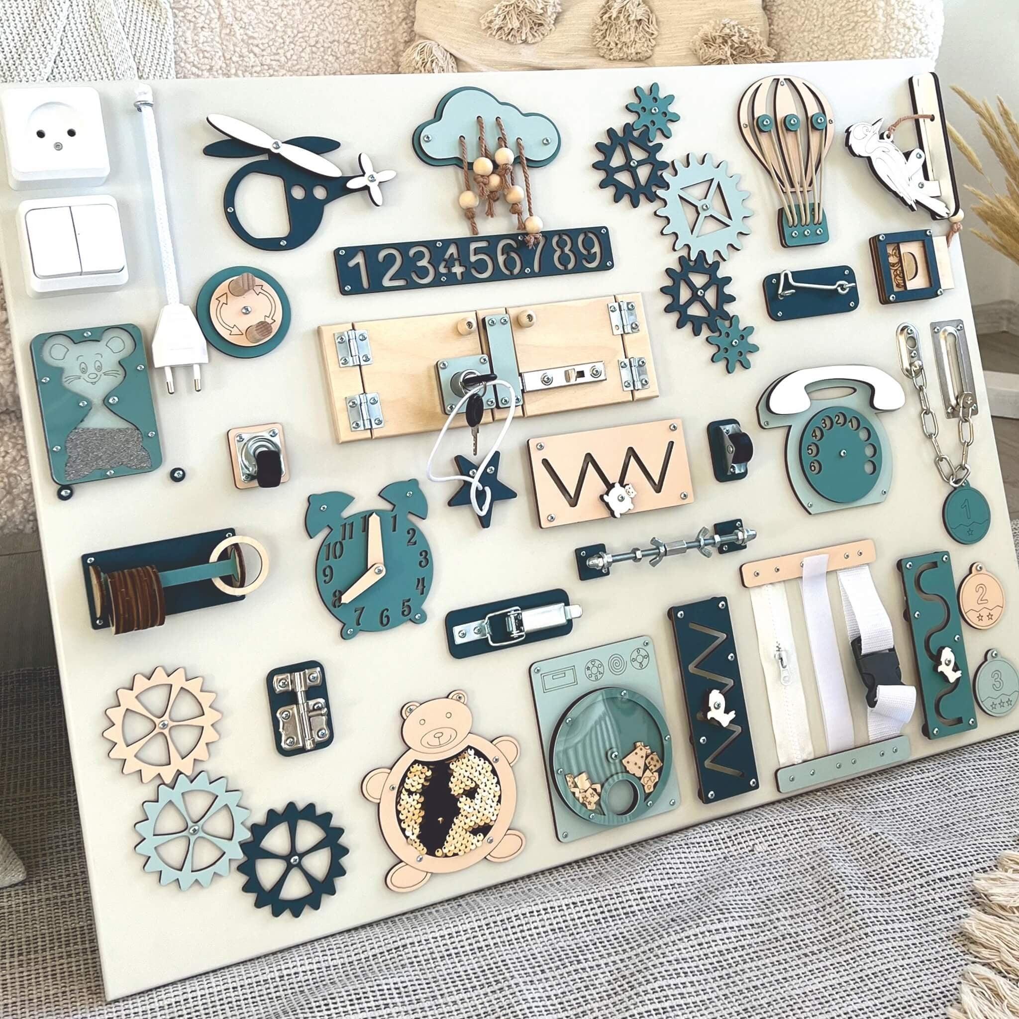 Wooden Montessori activity board with gears, latches, clock, and zippers for toddler fine motor skills development