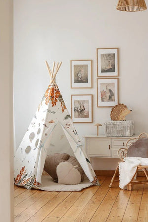 Moi Mili woodland teepee styled in a children’s room with animal wall art, soft cushions and wooden furniture