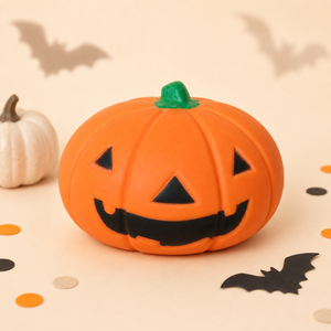Orange 15 cm Halloween pumpkin squishy with black Jack-o’-lantern face, green stem and bat decorations