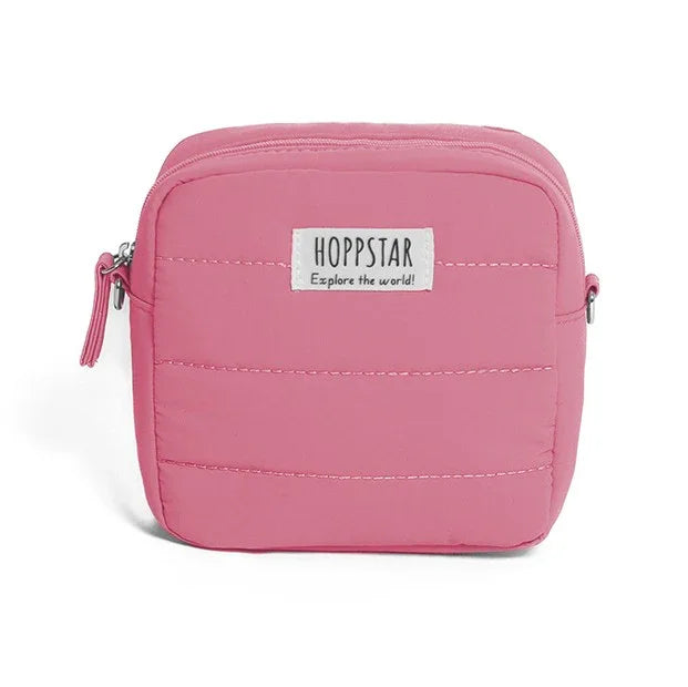 Custodia imbottita per fotocamera Hoppstar rosa con etichetta frontale e chiusura a zip