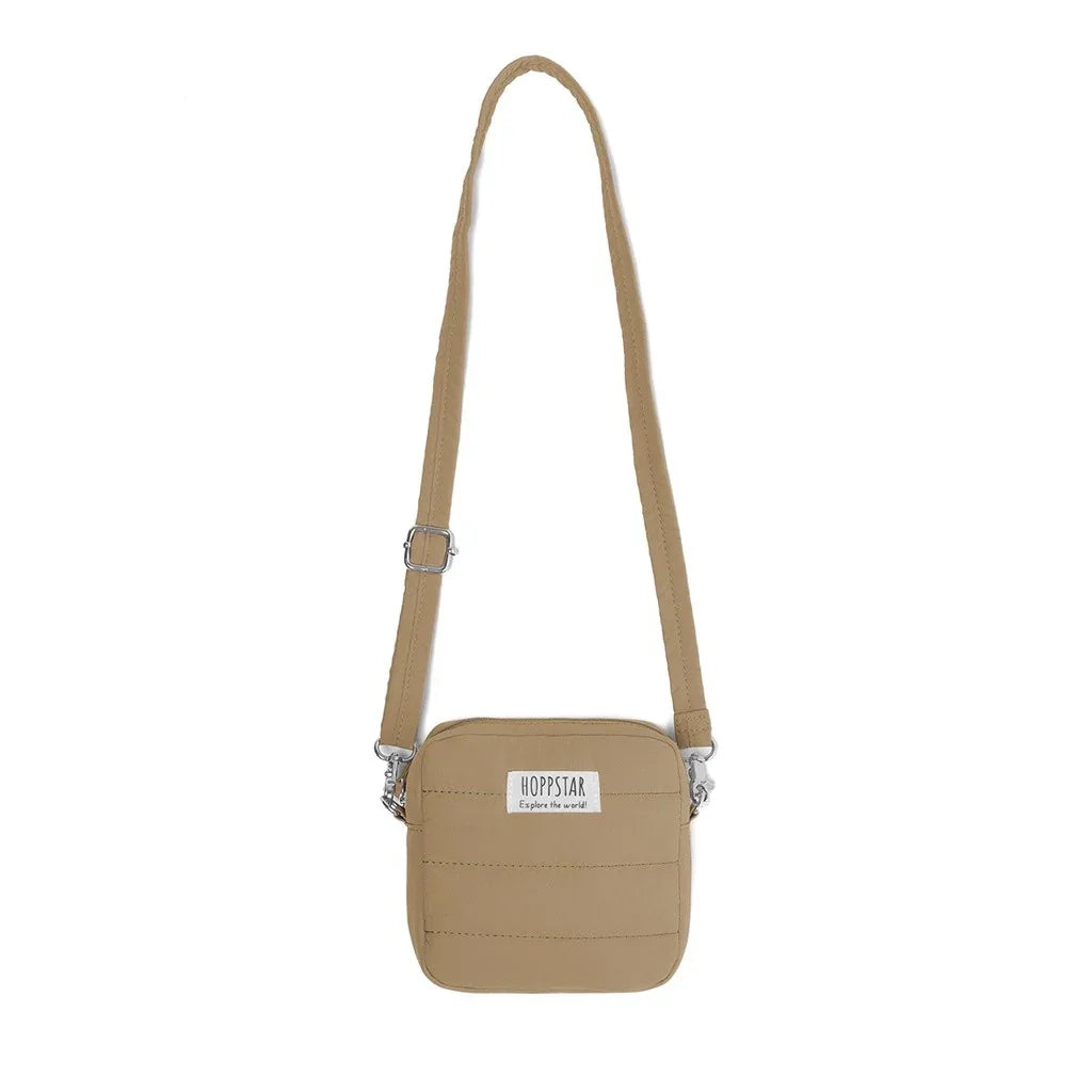Borsa fotografica Hoppstar midi in beige con tracolla regolabile e patch logo frontale