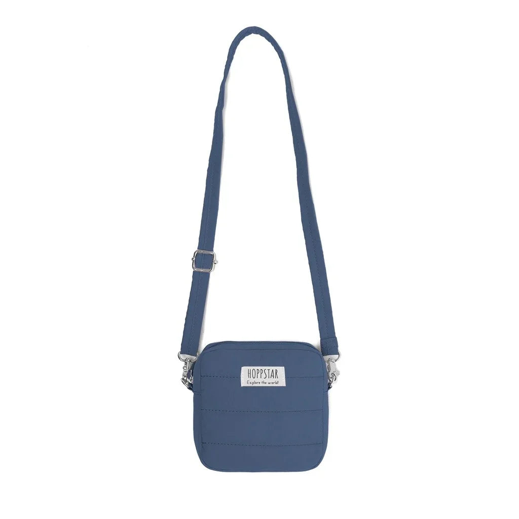 Borsa fotografica Hoppstar blu con tracolla regolabile e patch logo frontale