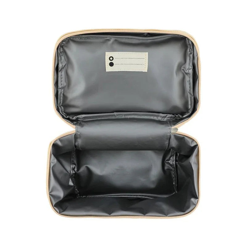 Lunchbox isotherme ouverte, intérieur noir imperméable, fermeture zippée.