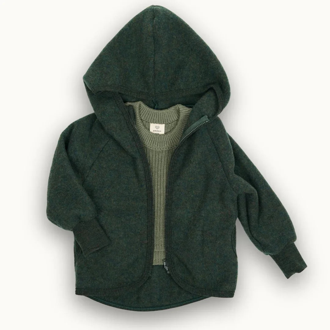 Dark green wool blend hooded baby jacket with front zipper and ribbed cuffs, layered over knit sweater