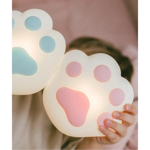 silicone paw-shaped night light in pastel pink and blue, nursery decor