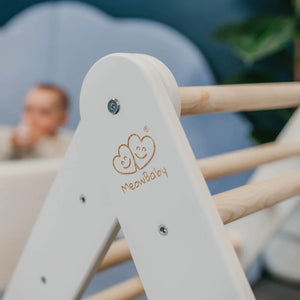 Close-up of white MeowBaby frame, fixings and natural wooden climbing rung