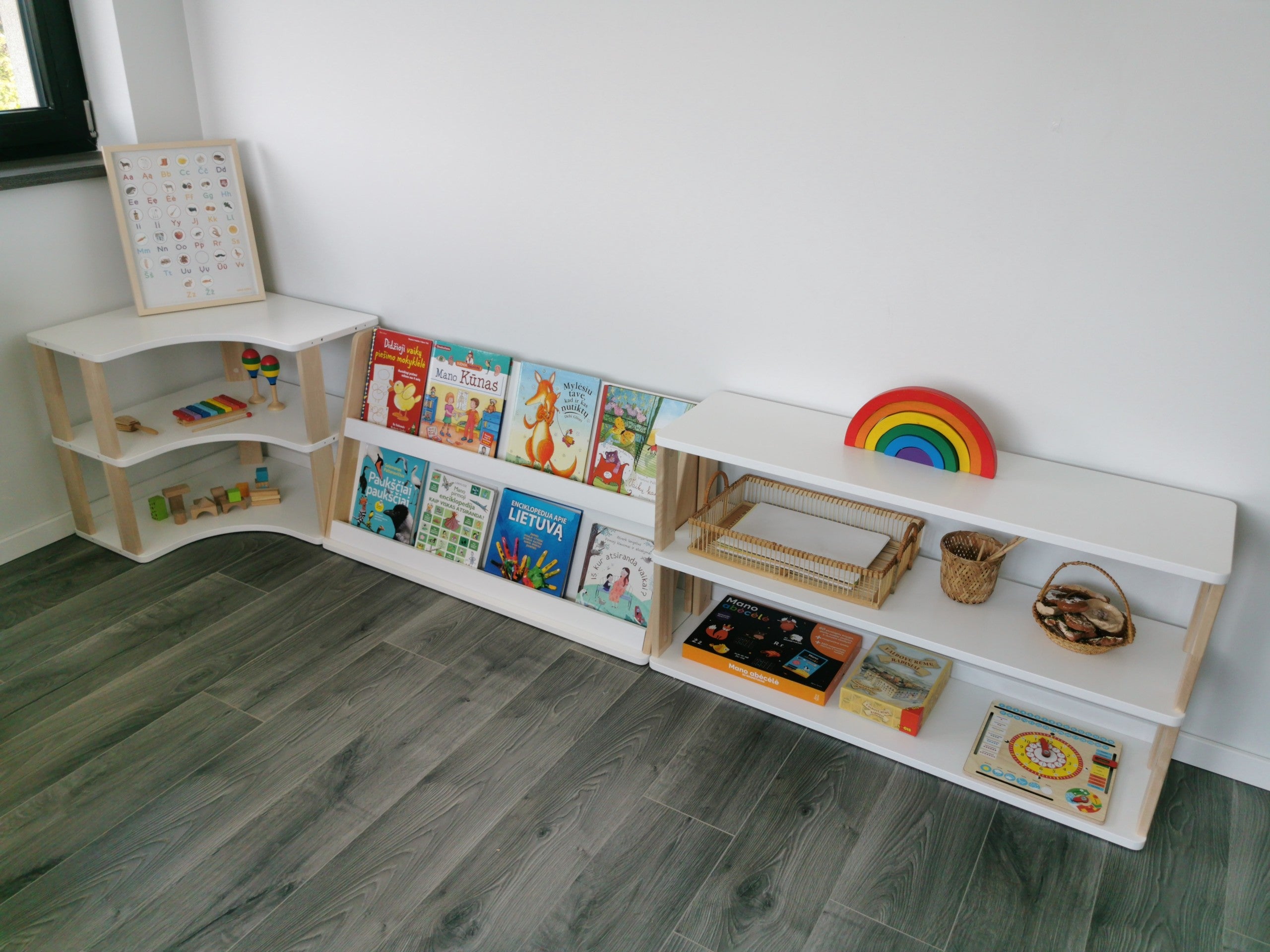 One Little Pine modular children’s furniture setup with front-facing bookshelf, curved shelf and low storage unit