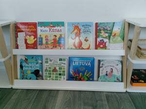 Front view of modular Montessori bookshelf with eight children’s book covers displayed across two levels