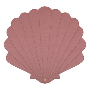 Front product view of the powder pink Moi Mili shell playmat on a white background