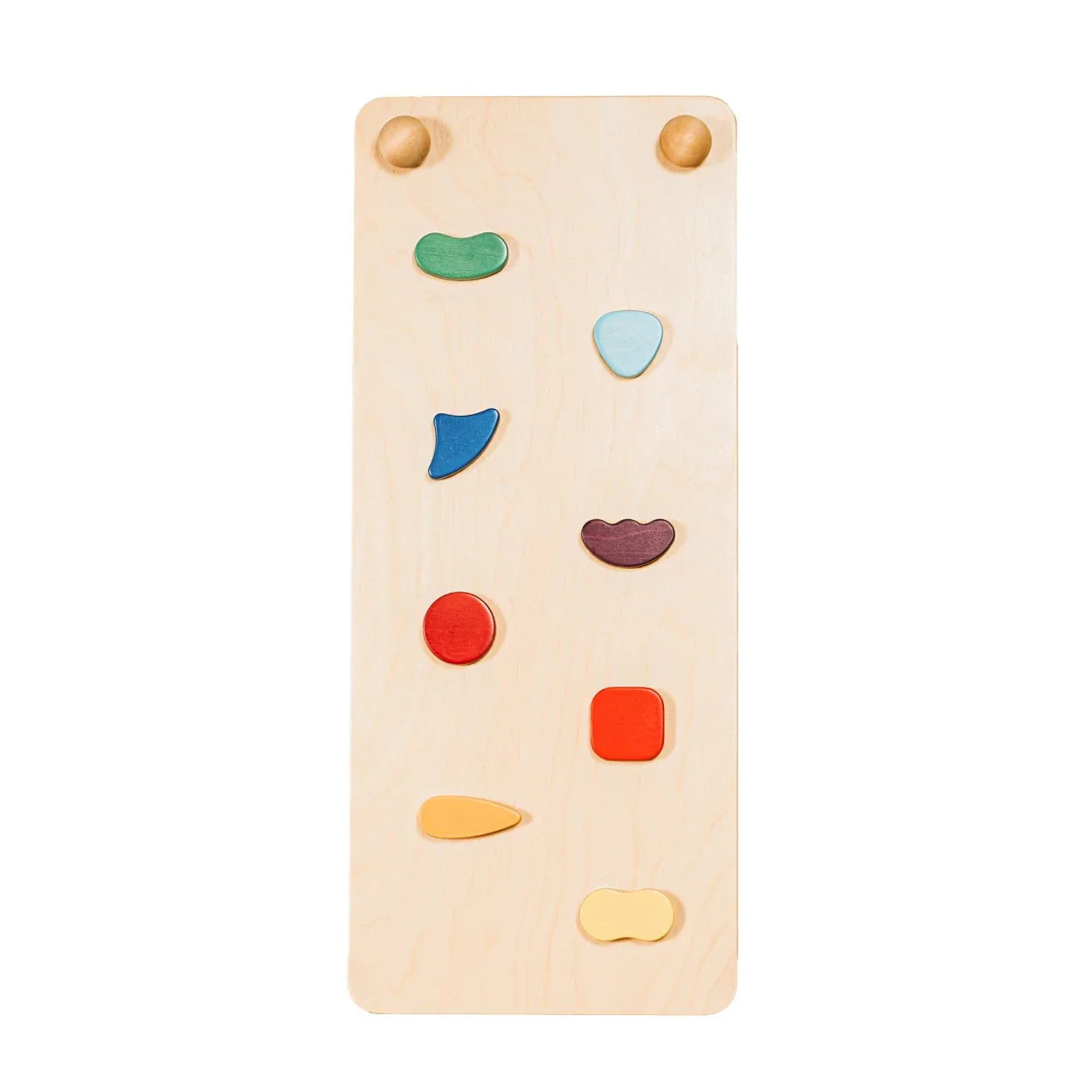 Natural wood toddler climbing wall with colorful geometric handholds for indoor play and motor skill development